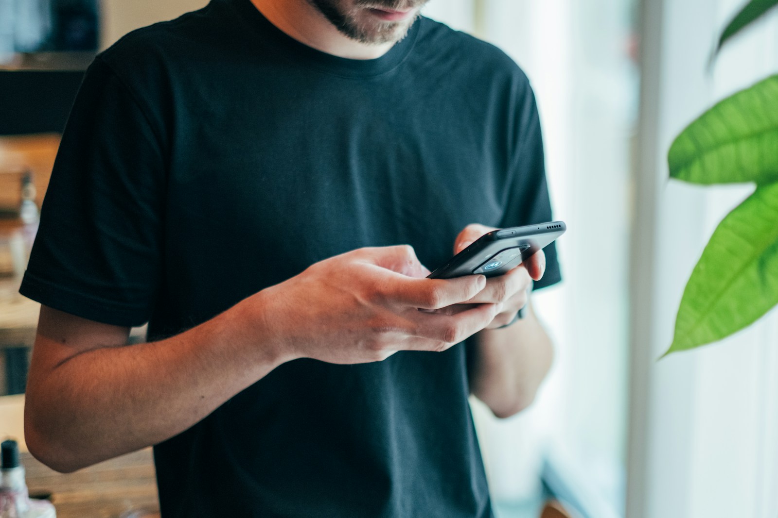 Person checking their phone signal